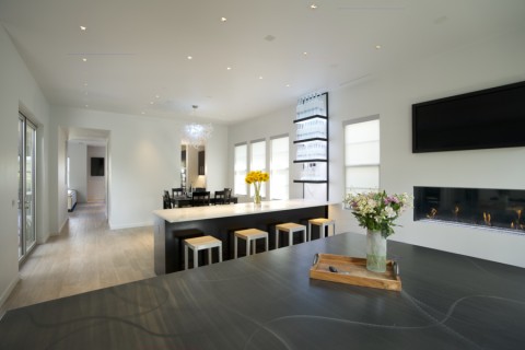 A living room and dining room featuring in-ceiling Sonance speakers.