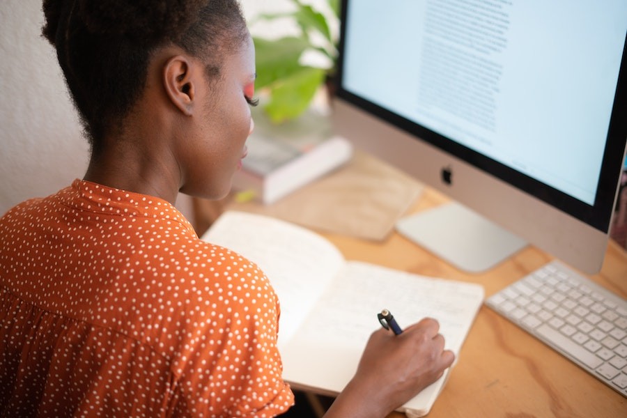 A woman working at her home office.