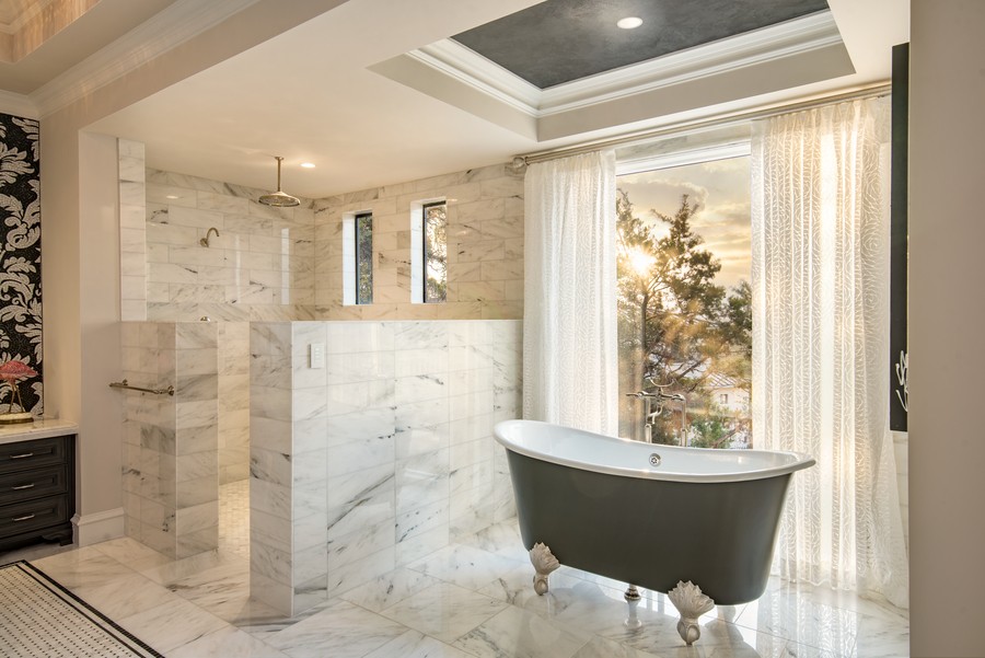 Bathroom with tunable lighting and natural light shining through the window.