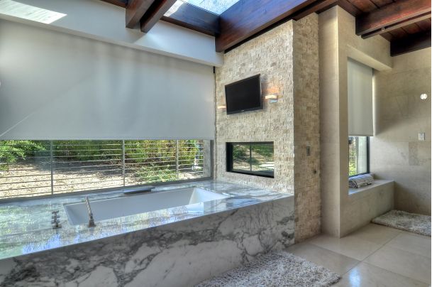 Media and Shading in a marble bathroom