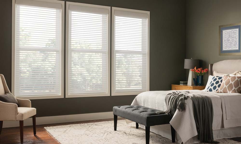 Horizontal Sheer Blinds by Lutron in an olive green bedroom